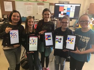 students with ipads and Mondrian art